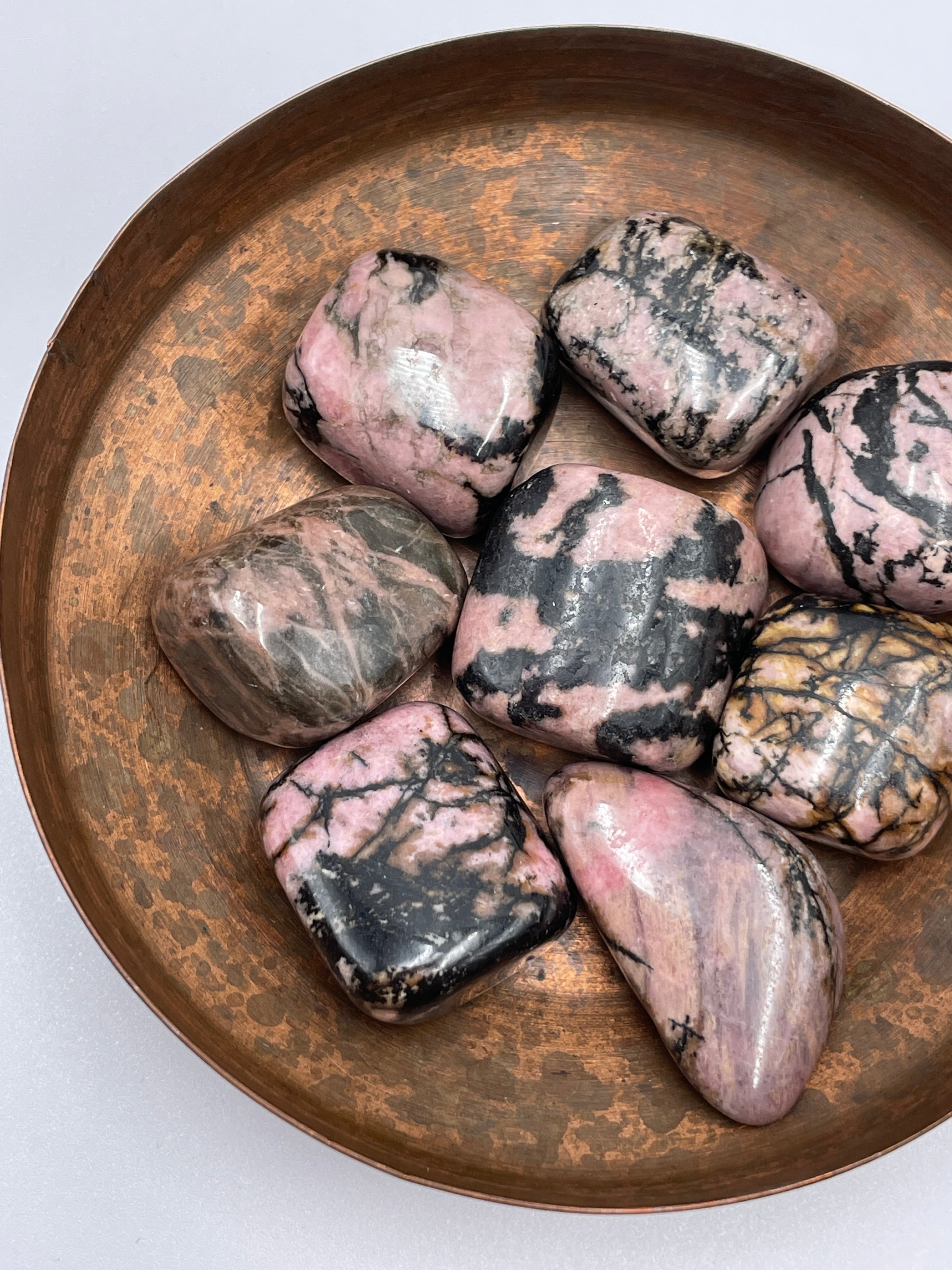 Rhodonite Tumbled Stone – The Crystal Cube
